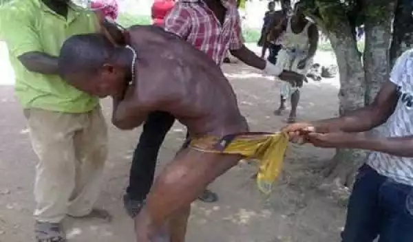 Omg! Man Disgraced and Stripped N*ked for Snatching Woman